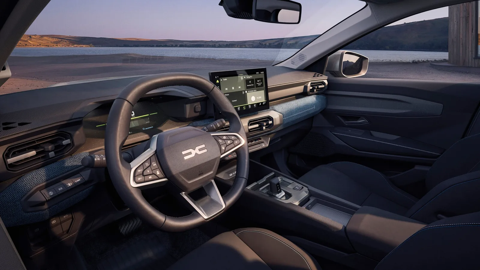 Dashboard van de Dacia Striker met stuur en groot multimediascherm