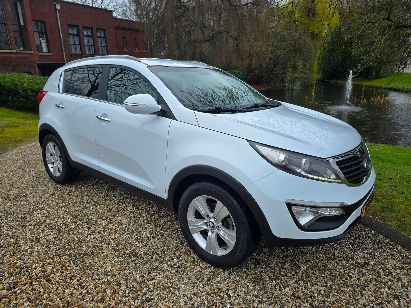 Kia Sportage (2011) — foto 1