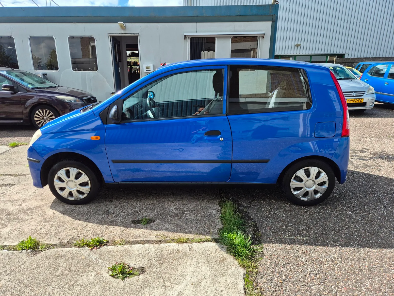 Daihatsu Cuore (2008) — foto 1