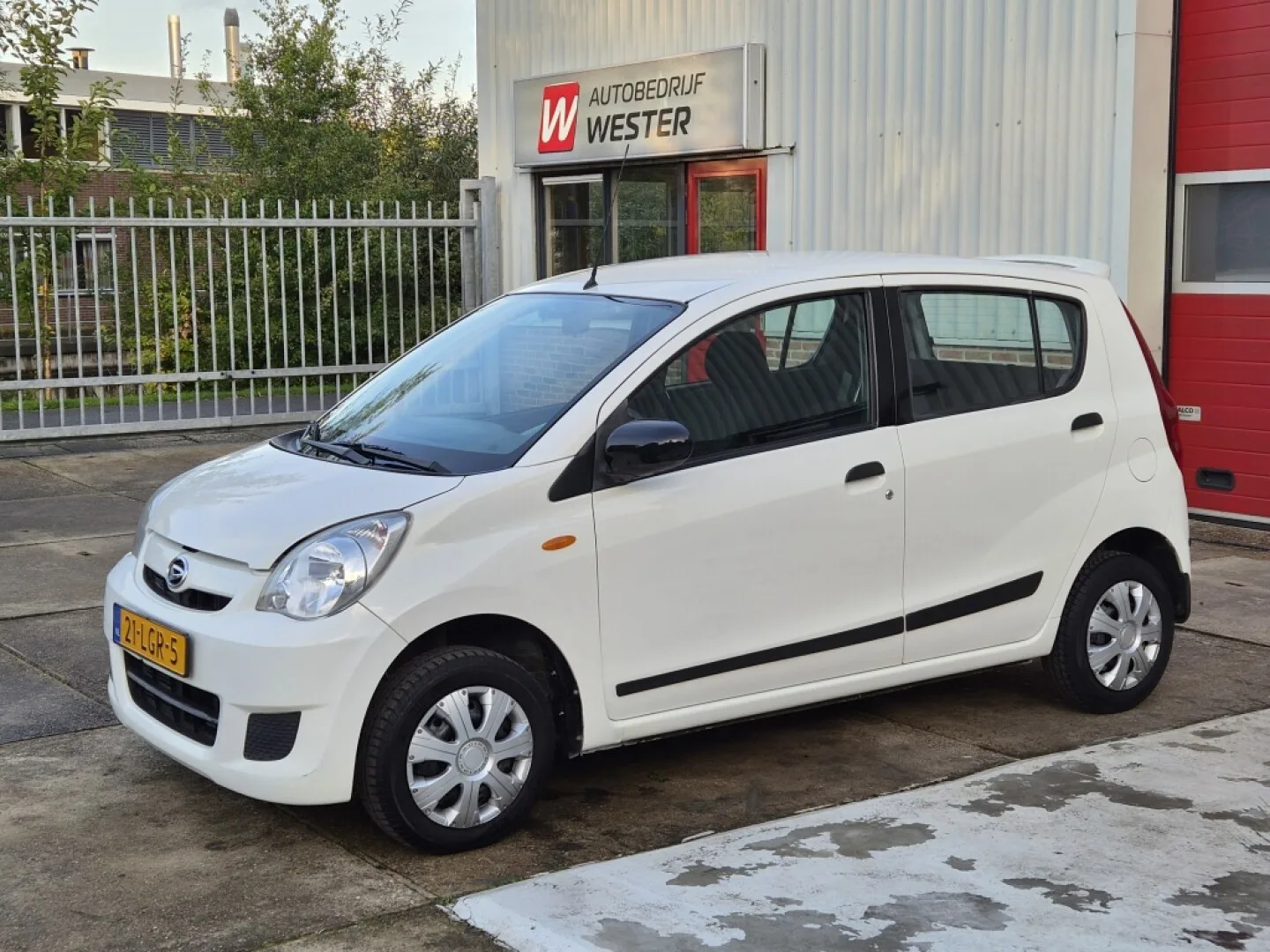 Daihatsu Cuore (2010) — foto 1