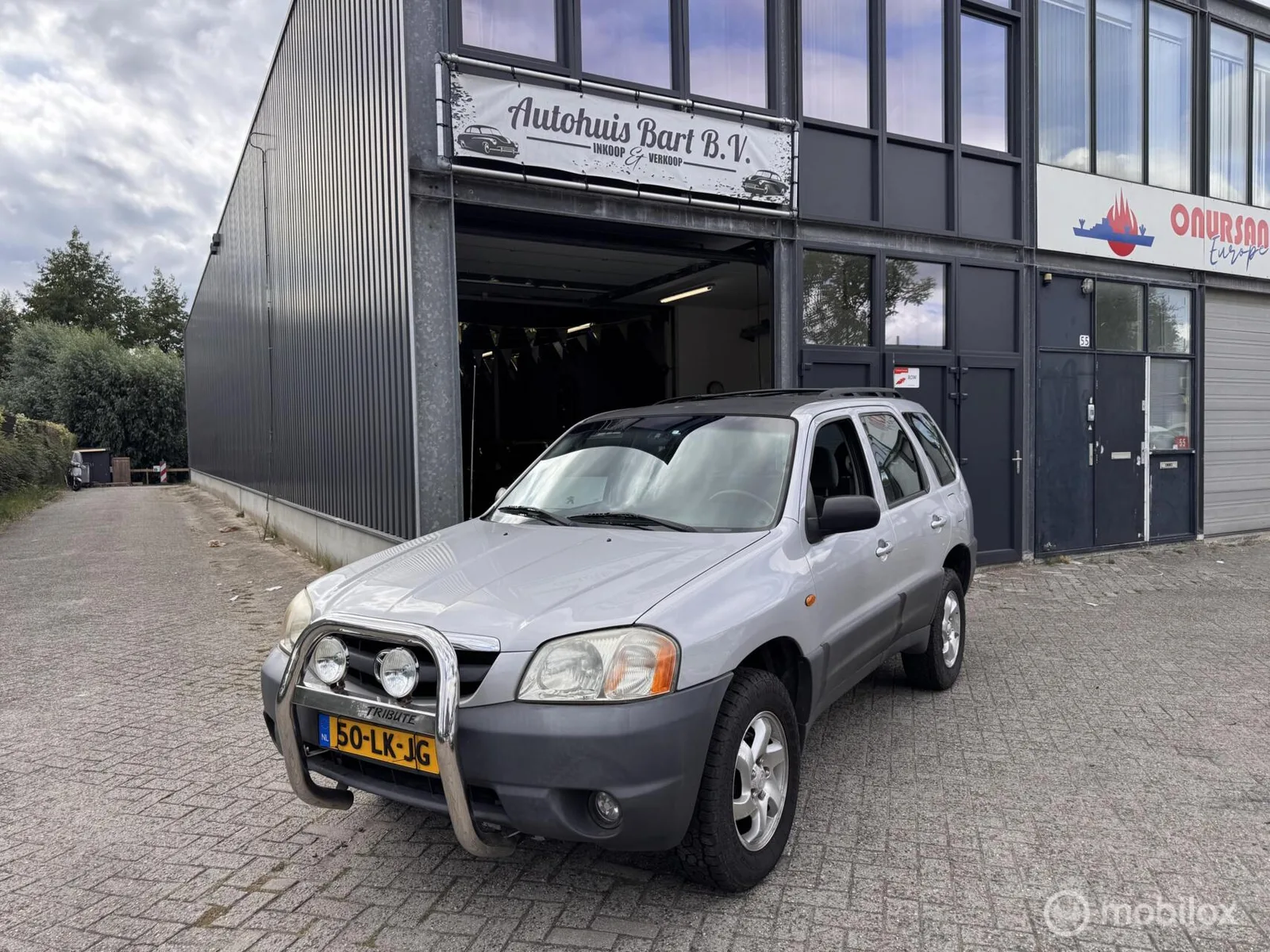 Mazda Tribute (2003) — foto 1