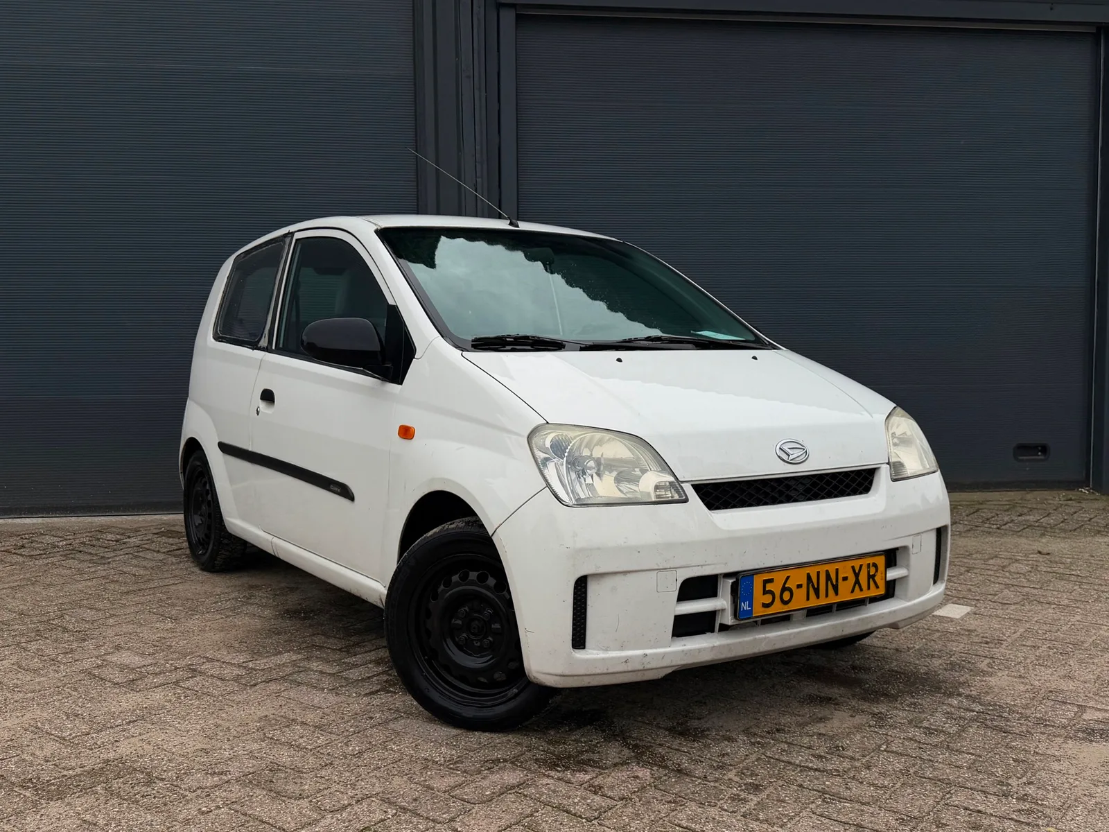 Daihatsu Cuore (2004) — foto 1