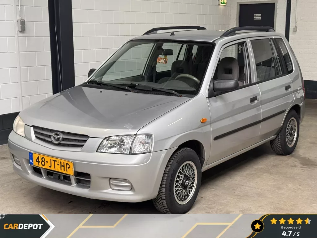 Mazda Demio (2002) — foto 1