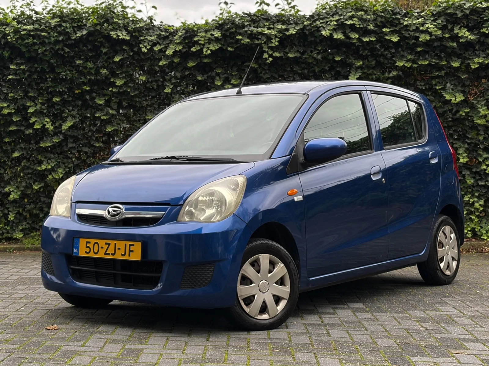 Daihatsu Cuore (2008) — foto 1