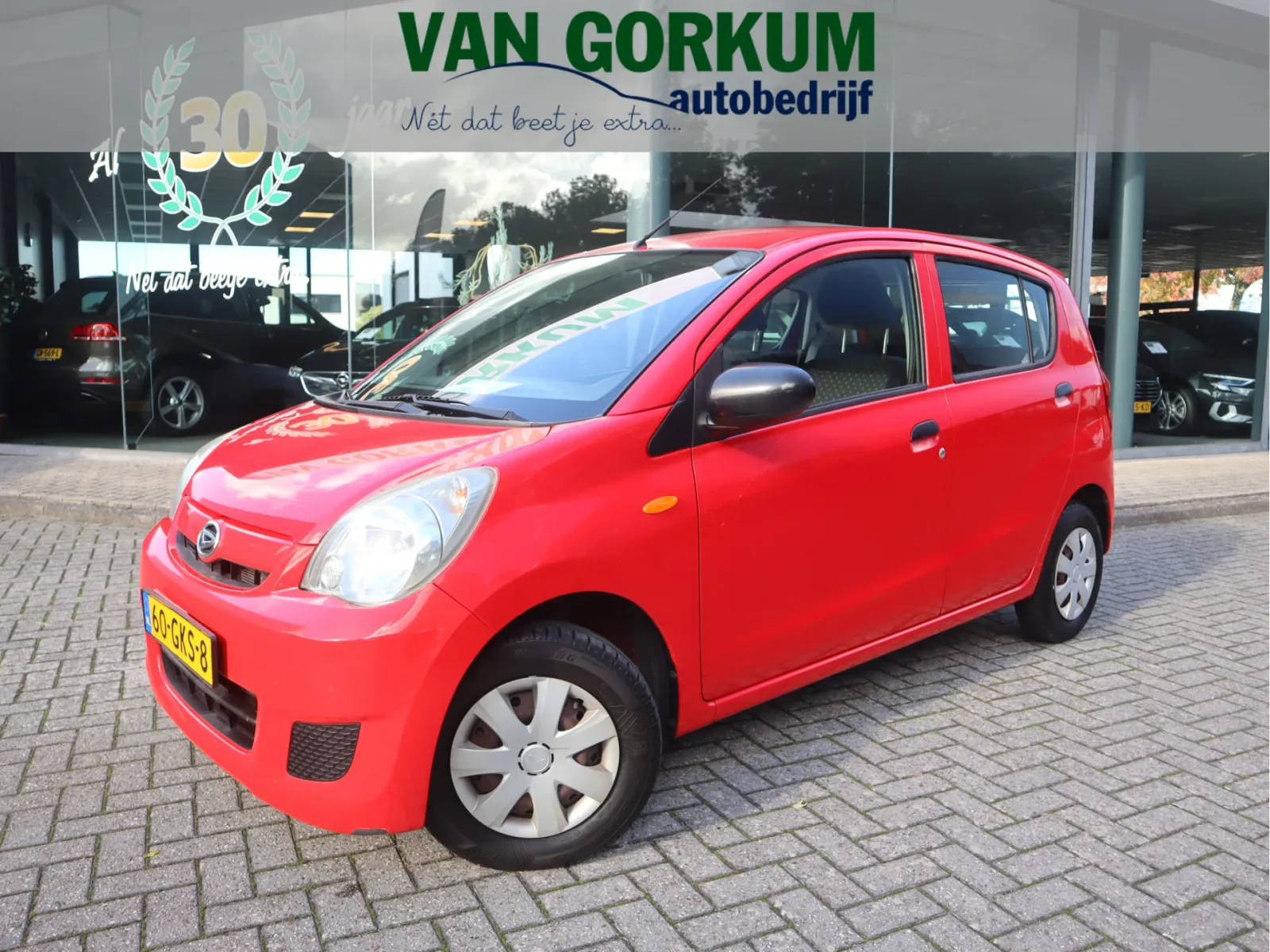 Daihatsu Cuore (2008) — foto 1