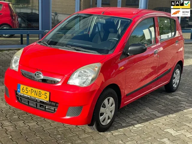 Daihatsu Cuore (2011) — foto 1