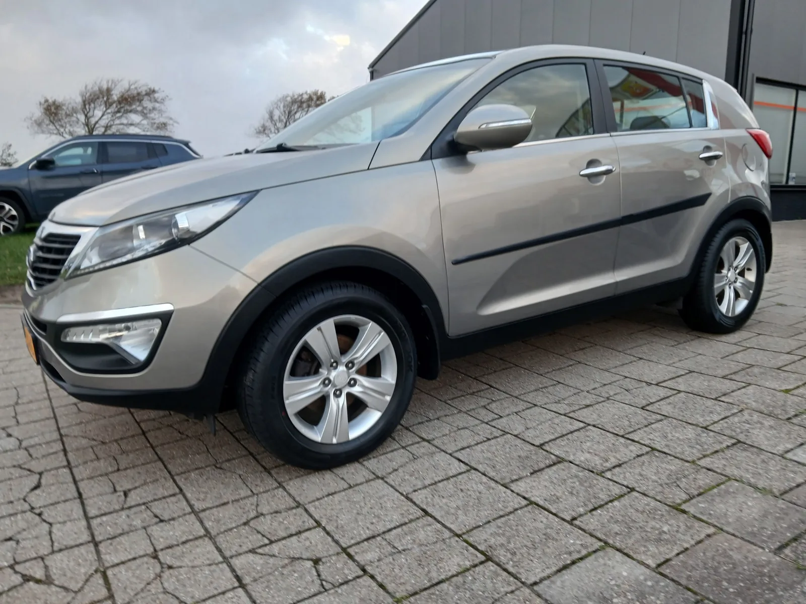 Kia Sportage (2011) — foto 1