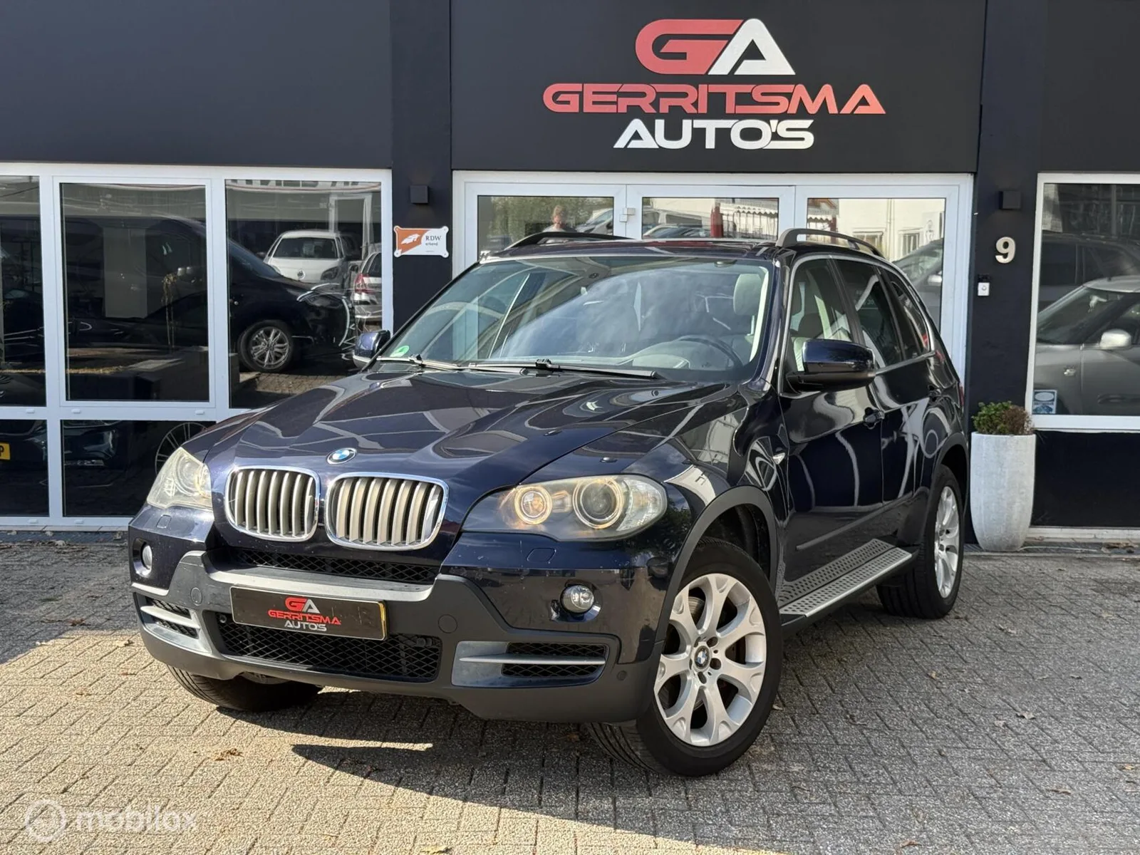 BMW X5 (2006) — foto 1
