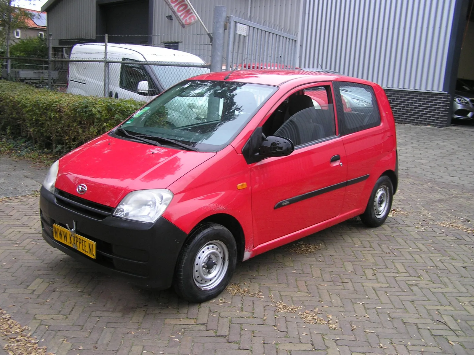 Daihatsu Cuore (2006) — foto 1