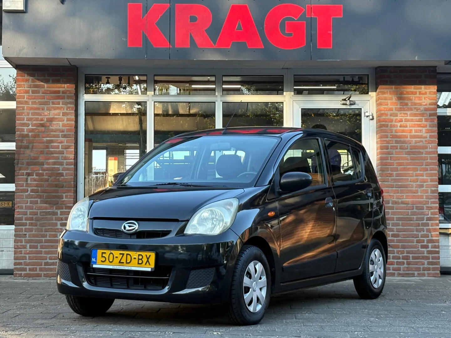 Daihatsu Cuore (2007) — foto 1