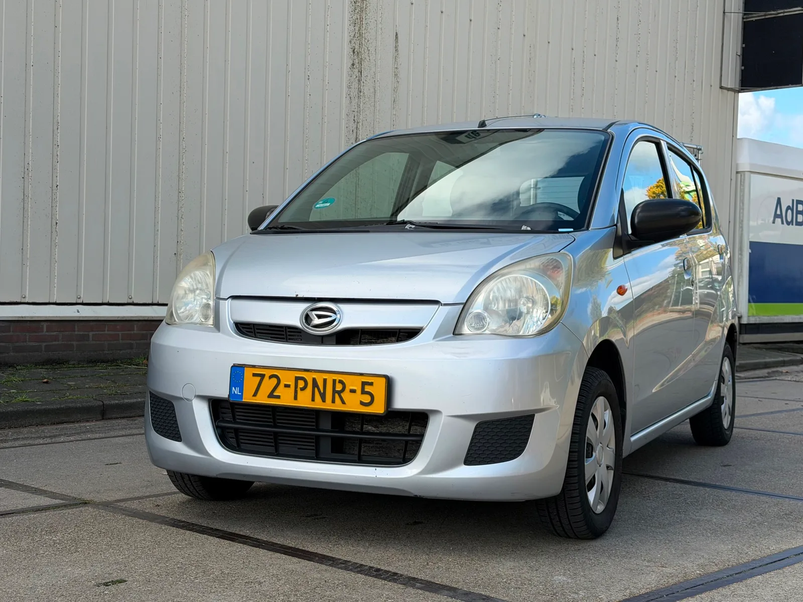 Daihatsu Cuore (2011) — foto 1