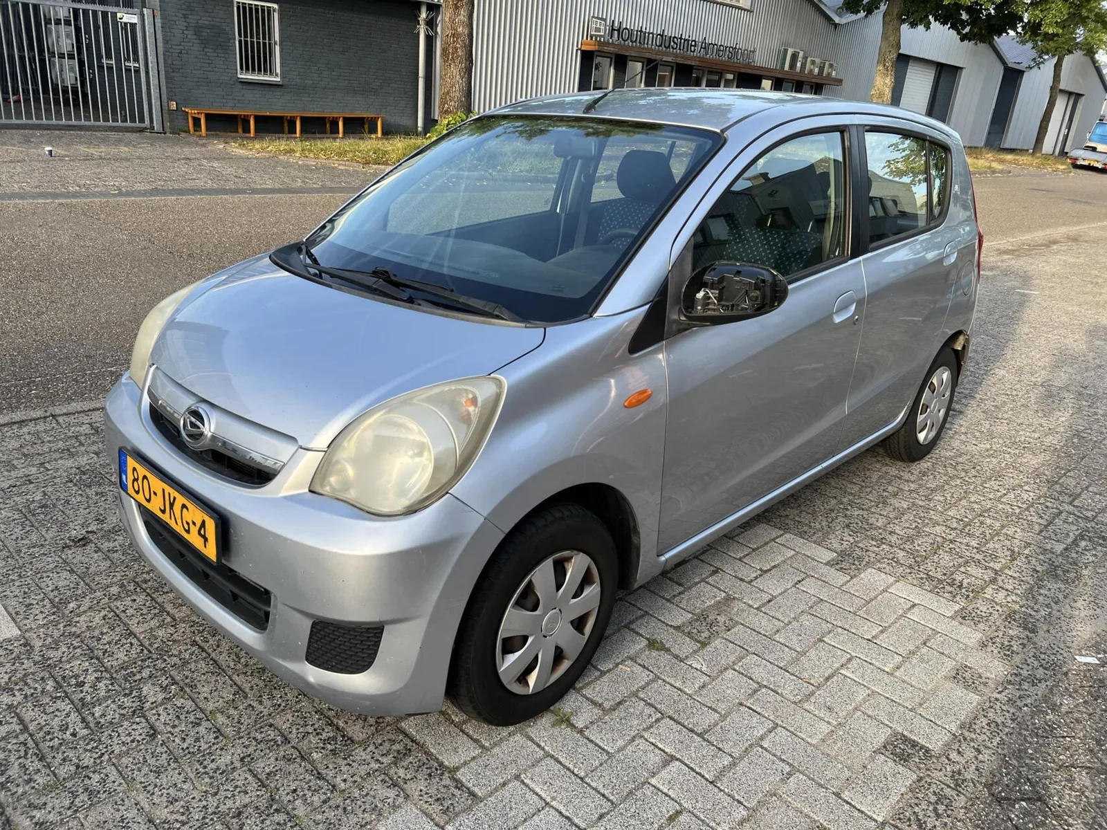 Daihatsu Cuore (2009) — foto 1