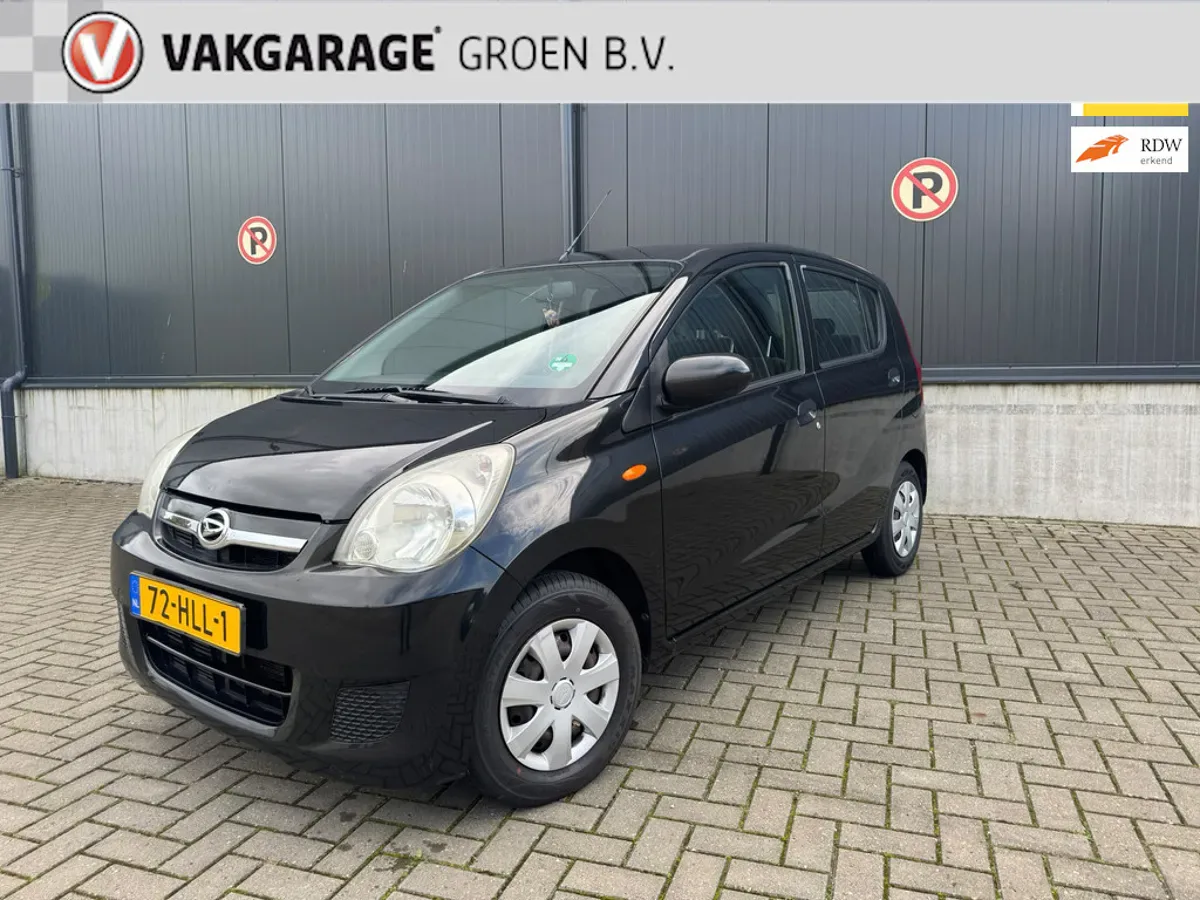 Daihatsu Cuore (2009) — foto 1