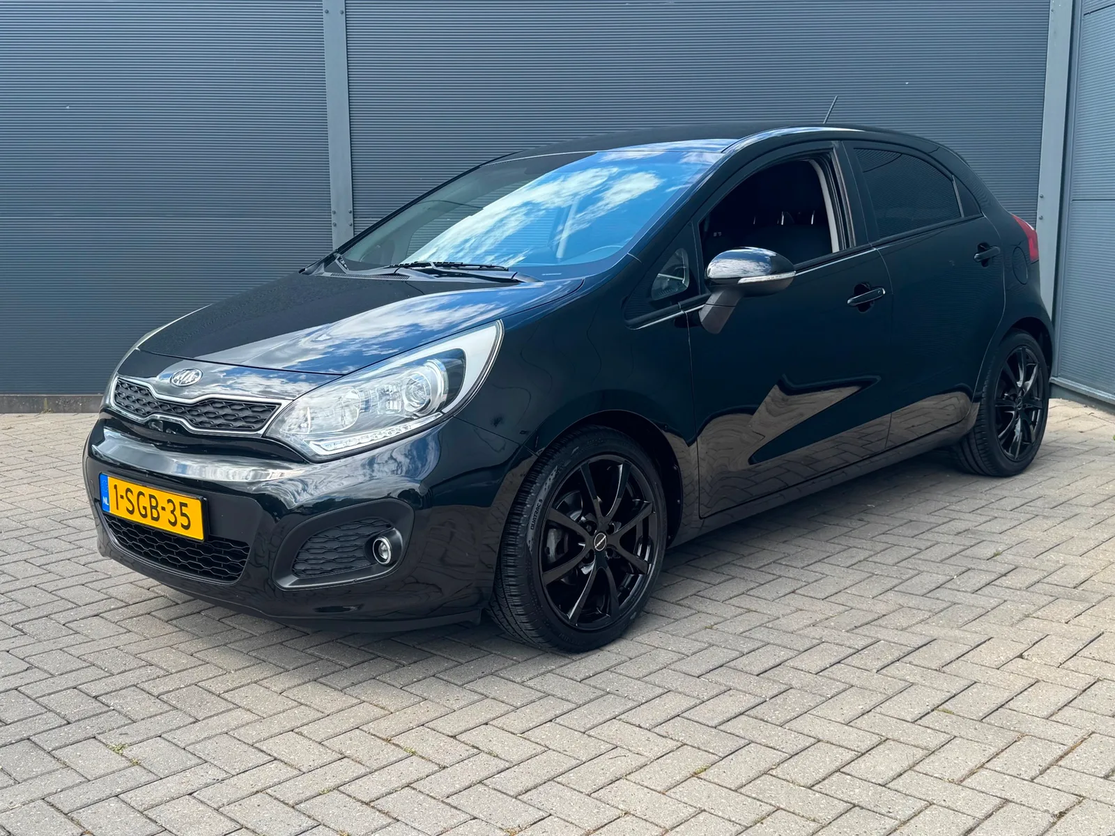 Kia Rio (2013) — foto 1