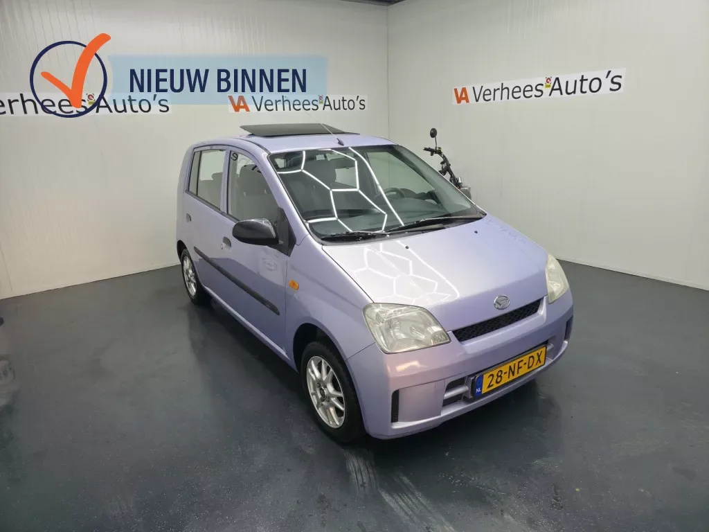 Daihatsu Cuore (2003) — foto 1
